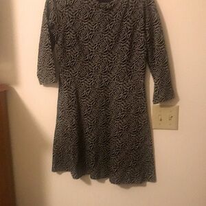 Black and gray rose patter knit dress.  Has metallic like sparkle to the flowers